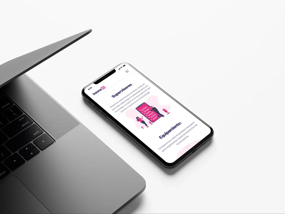 Inzone: Mobile services page next to a laptop